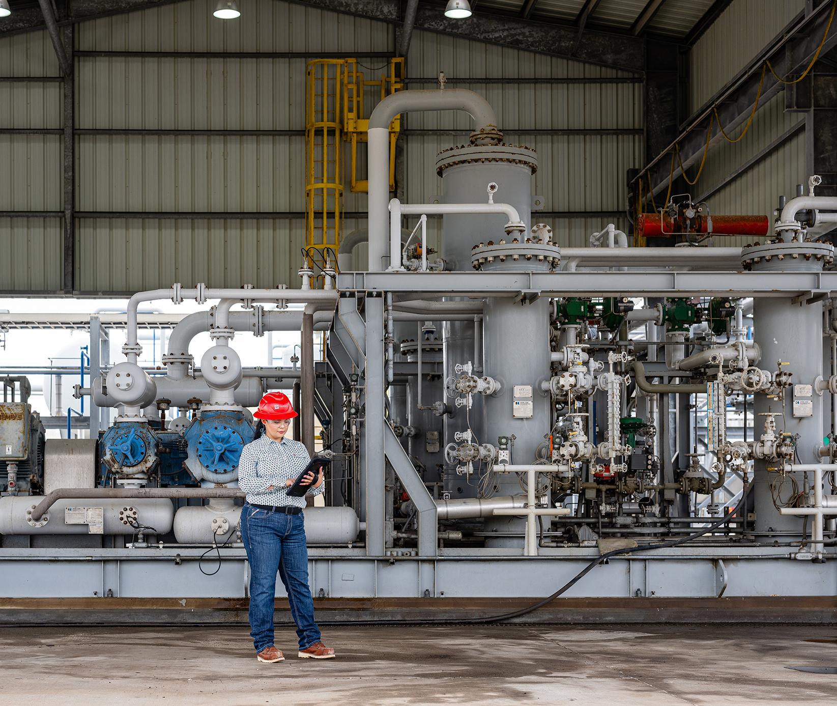 Employee in front of machinery