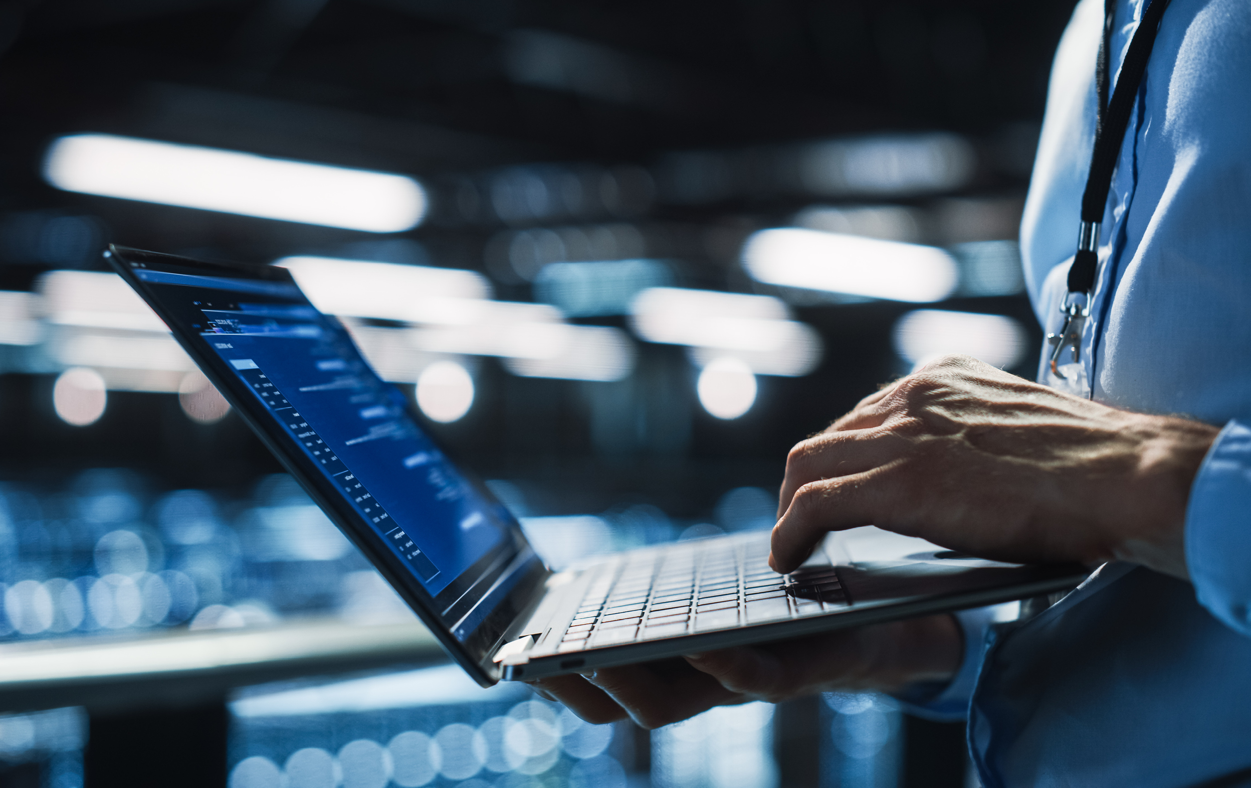 A person holding a laptop